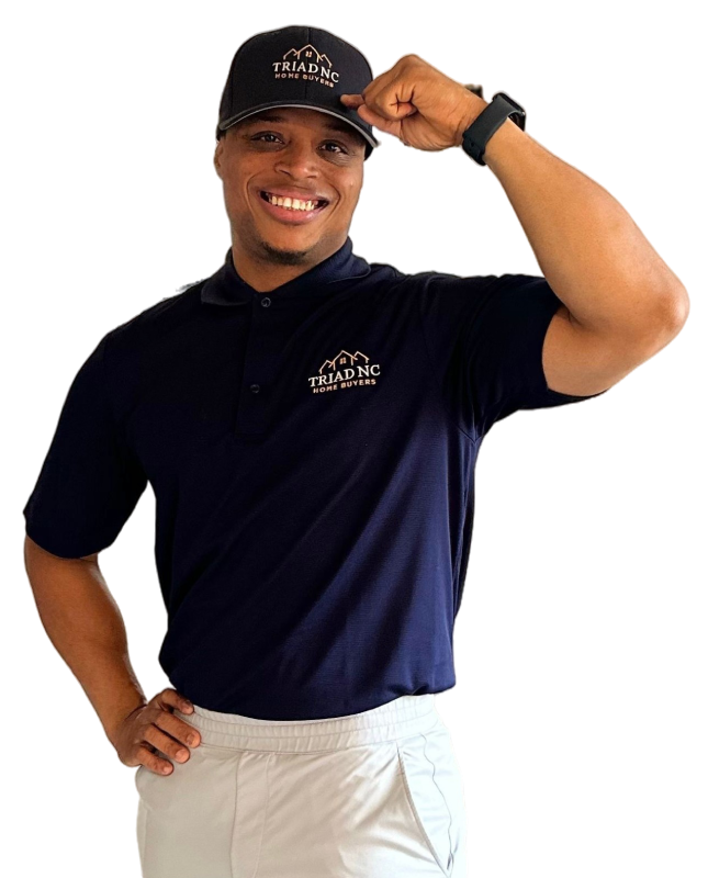 Portrait of a smiling male real estate expert wearing a branded navy polo shirt.